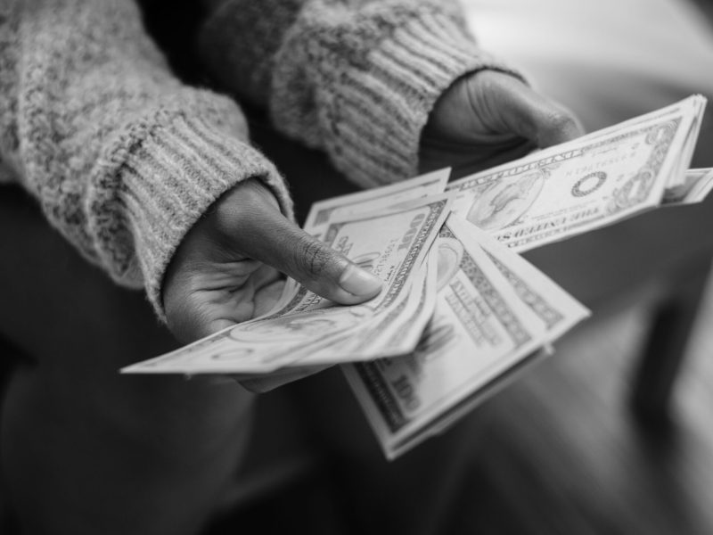 Closeup of woman counting money