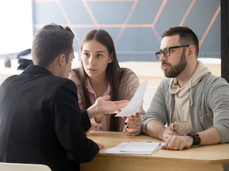 Angry,Millennial,Couple,Complaining,Having,Claims,About,Bad,Contract,Terms